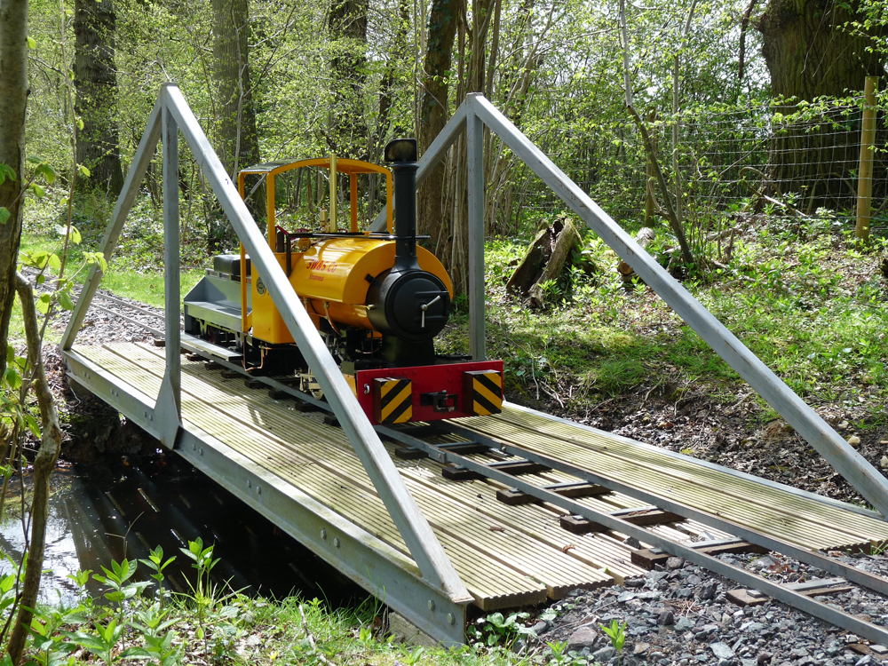 Crossing a bridge on the ADMES track at Wherwell